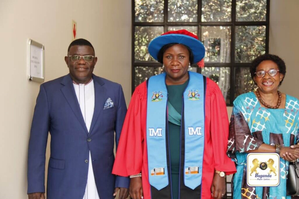 Omuk. Leticia Nakimuli (centre) celebrates after earning a PhD from the Uganda Management Institute